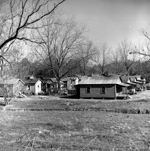 old photo of a group of shack-like old houses