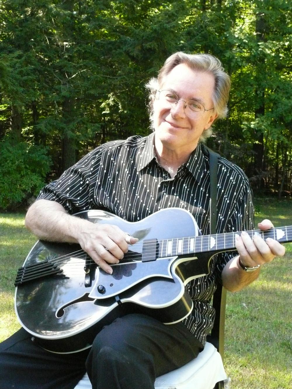 John Sebastian playing guitar