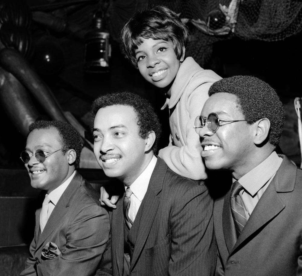 Black and white photo of a group of performers