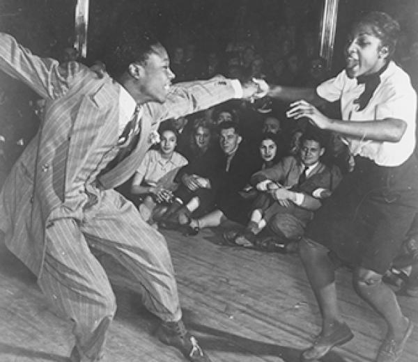 black and white photo of a couple dancing to early jazz
