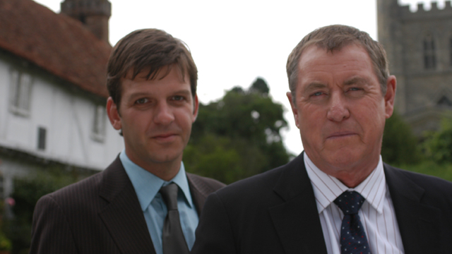 Two investigators smiling